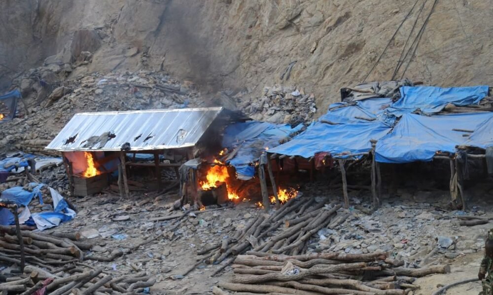 Makeshift structures burning at an illegal mining site during a NAIMOS operation