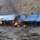 Makeshift structures burning at an illegal mining site during a NAIMOS operation